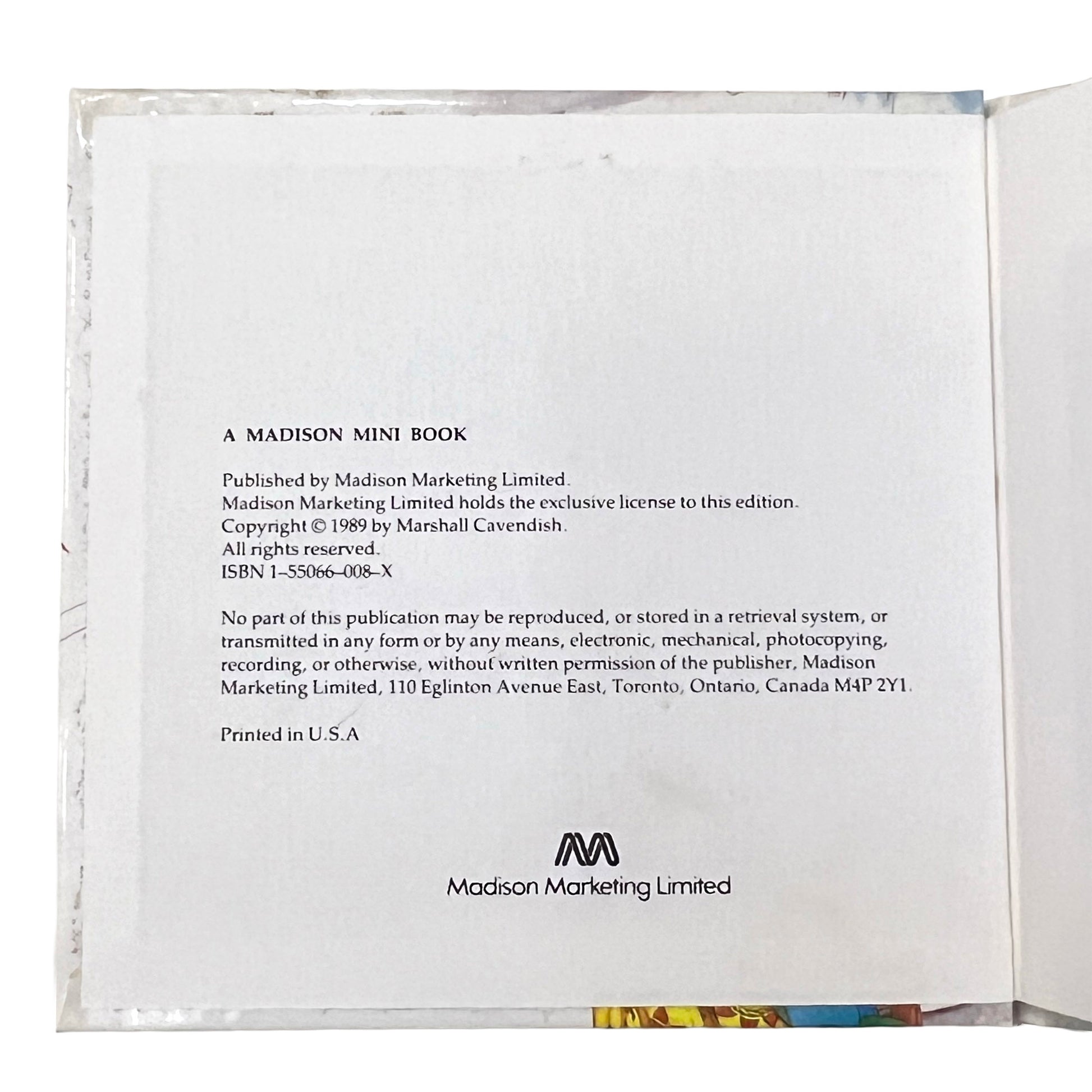 Back cover of a book with text and Madison Marketing Limited logo
