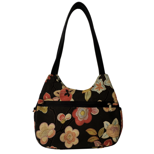 Floral-patterned handbag on a white background