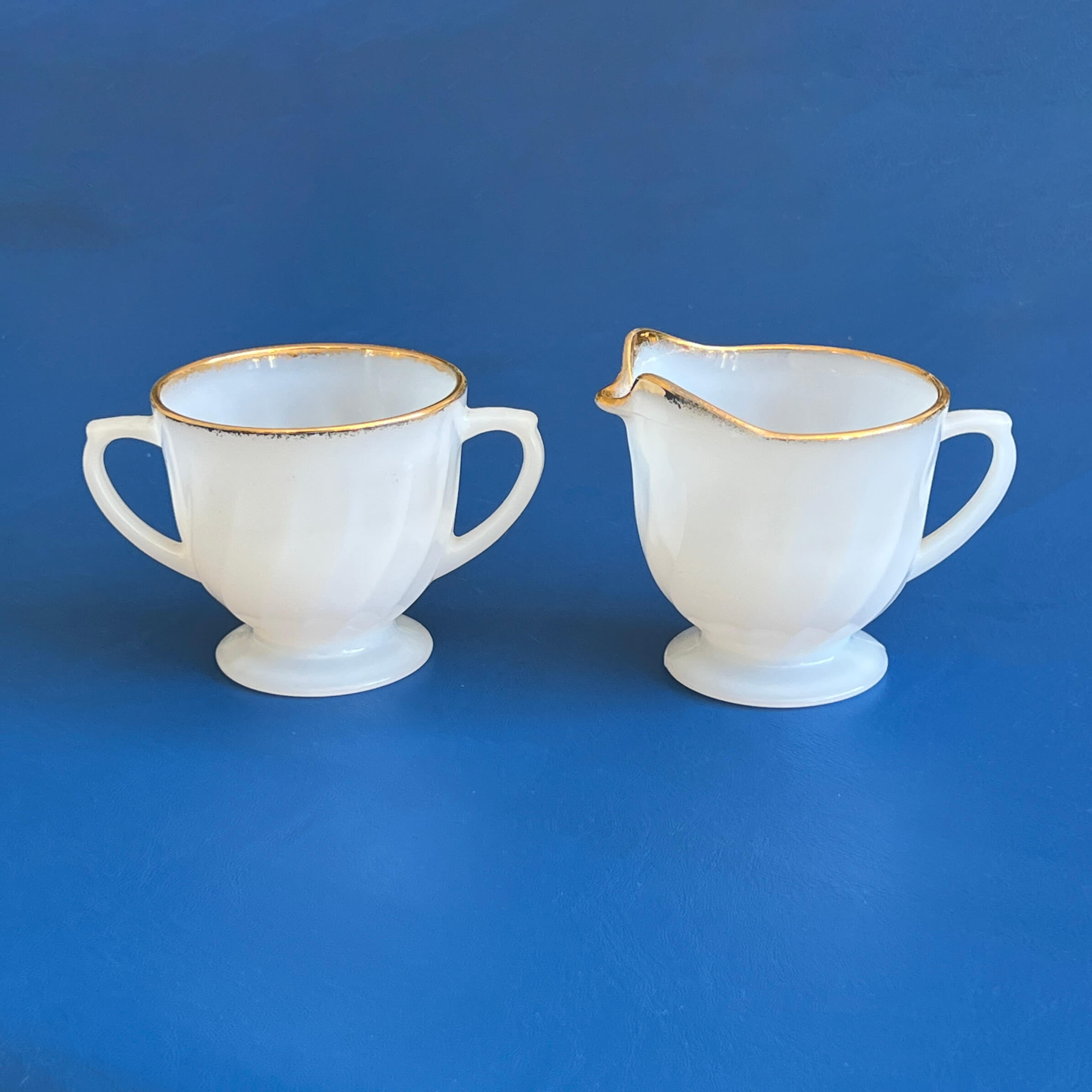 http://www.ebargainsanddeals.com/cdn/shop/files/Fire-King-Milk-Glass-Creamer-and-Sugar-Bowl.Side-View.-Shop-eBargainsAndDeals.jpg?v=1682878377