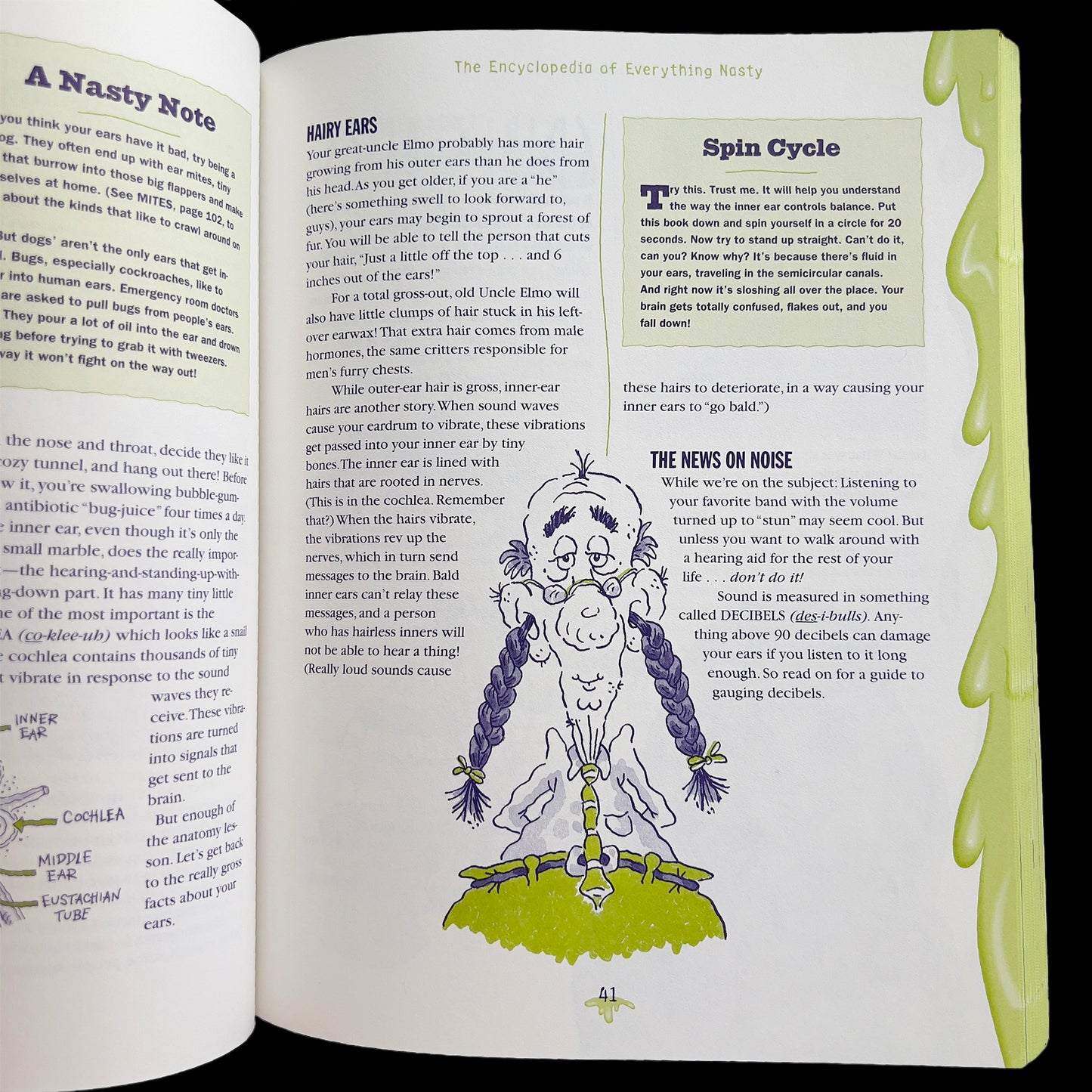 Open book with illustrations and text on a green background