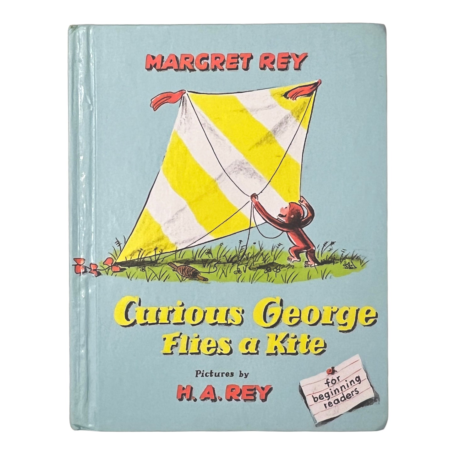 Book cover of 'Curious George Flies a Kite' by Margret and H.A. Rey with a yellow kite illustration.