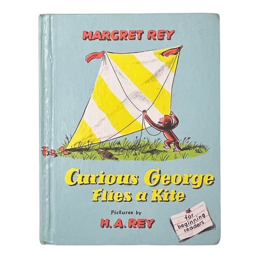 Book cover of 'Curious George Flies a Kite' by Margret and H.A. Rey with a yellow kite illustration.