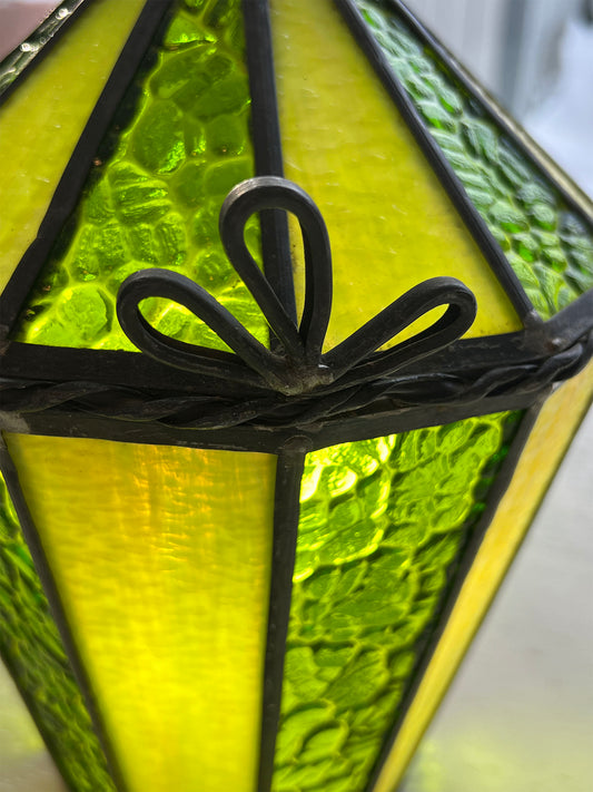 Green stained glass lamp with decorative metal fixture