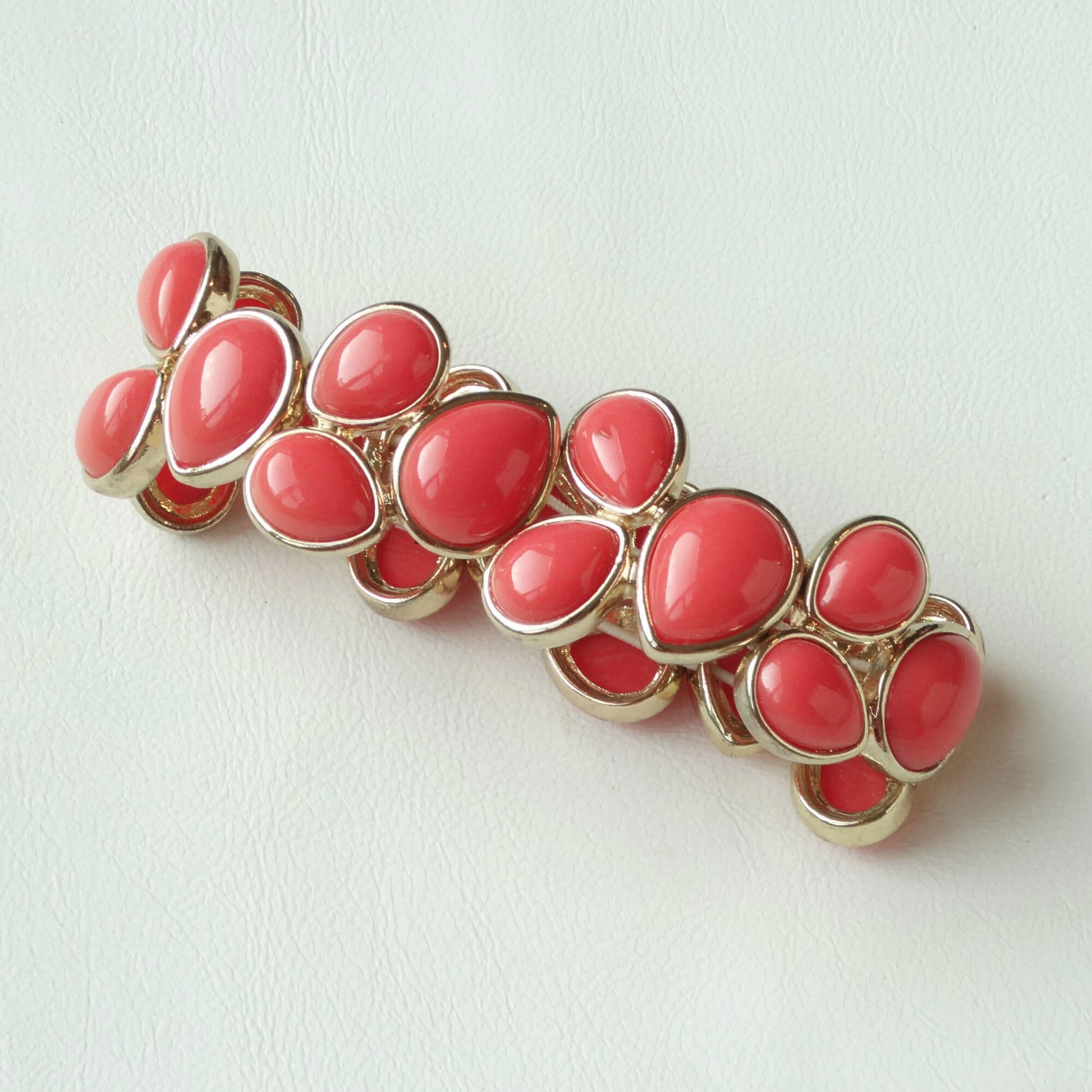 Napier-Coral-Teardrop-Stretch-Bracelet-laying-flat.