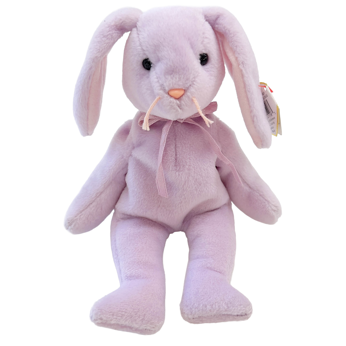 Pink plush bunny toy with a bow tie on a white background