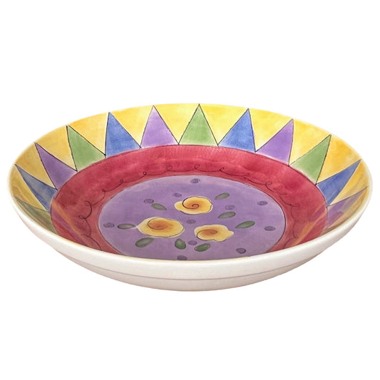 Decorative ceramic bowl with colorful geometric design on a white background