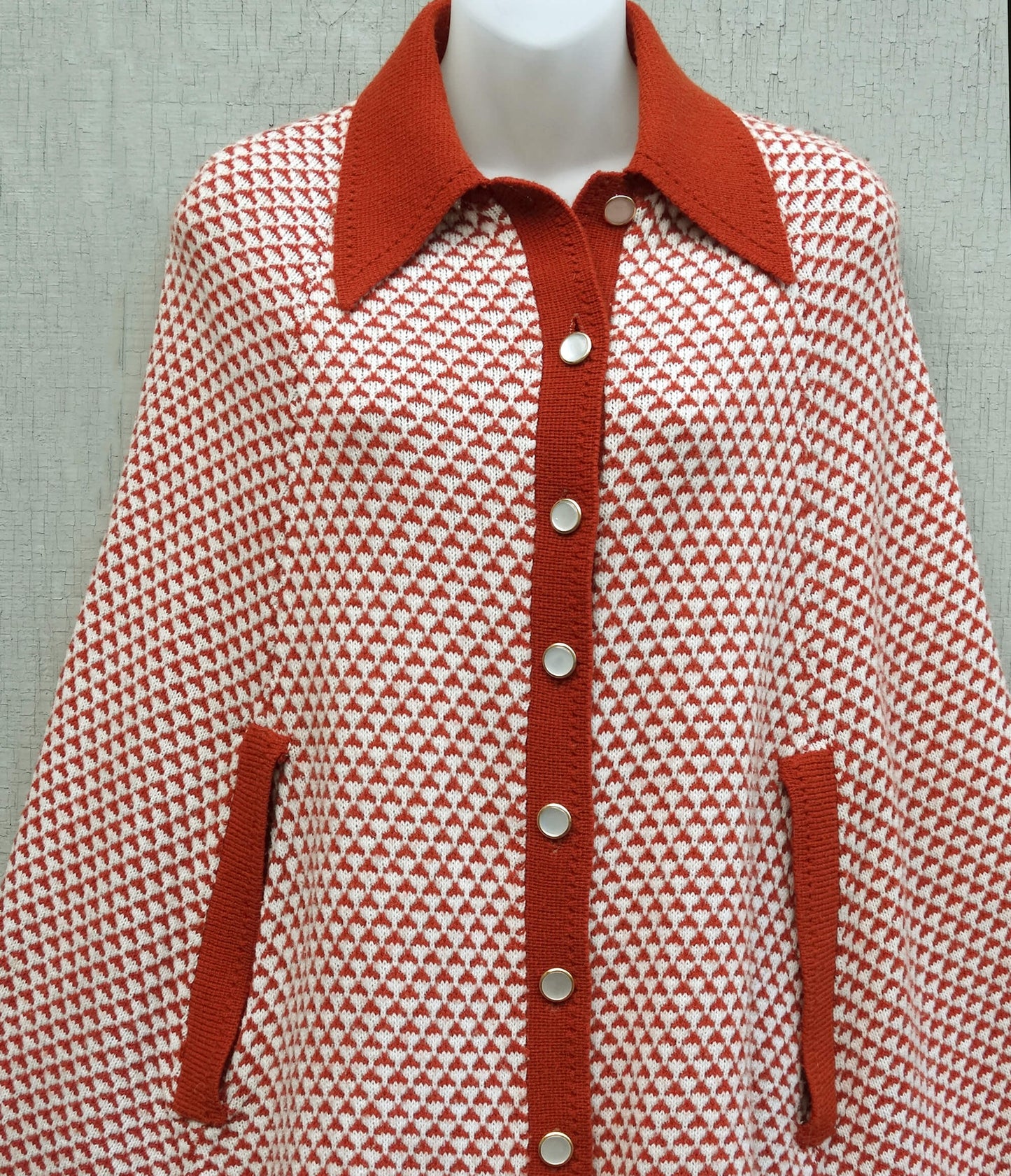 Sweater-Bee-Cape by-Banff.-Orange-and-White-Patterned.-Mother-of-Pearl-Buttons.-Fringed.-Shop-eBargainsAndDeals.com.