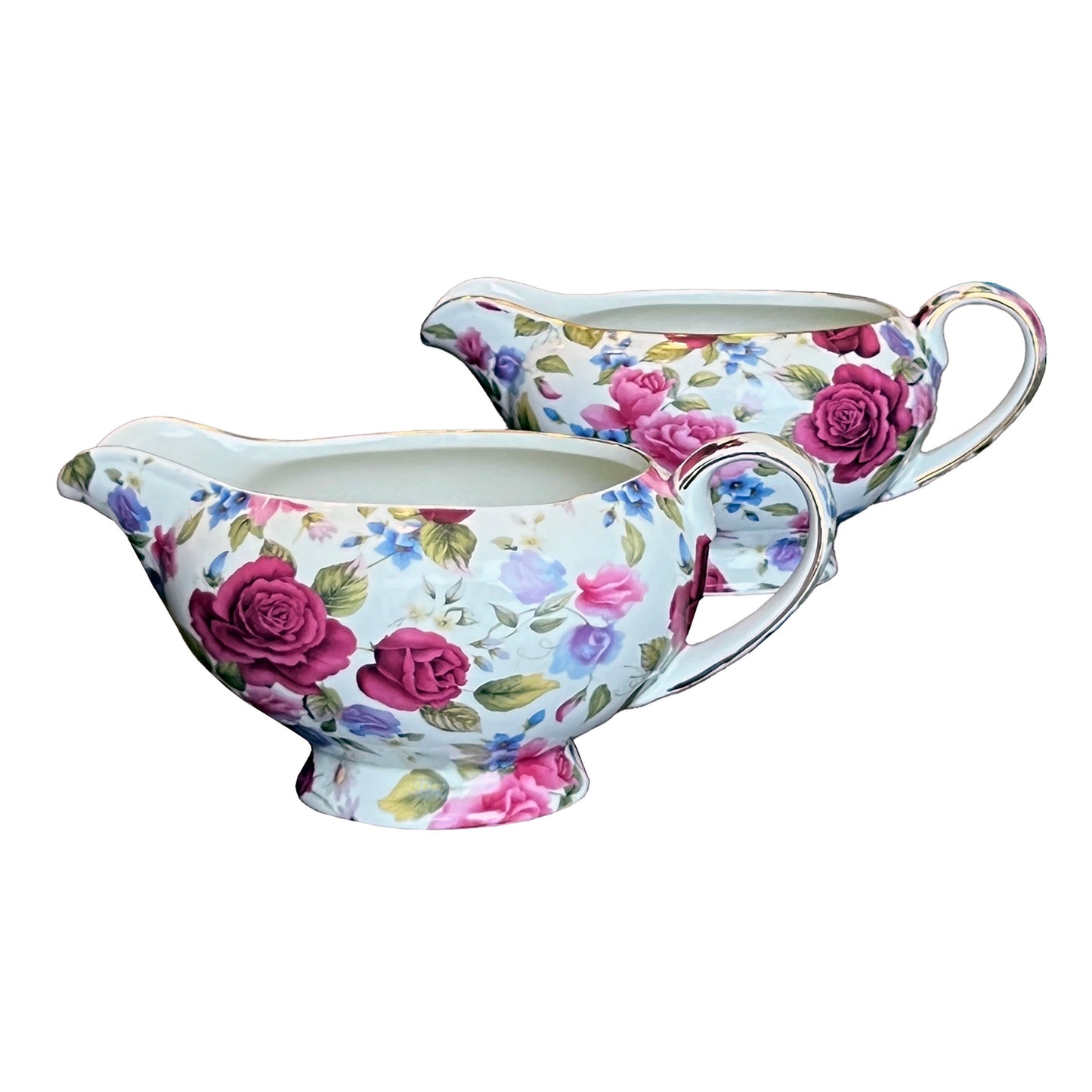 Floral-patterned gravy boat and creamer set on a white background
