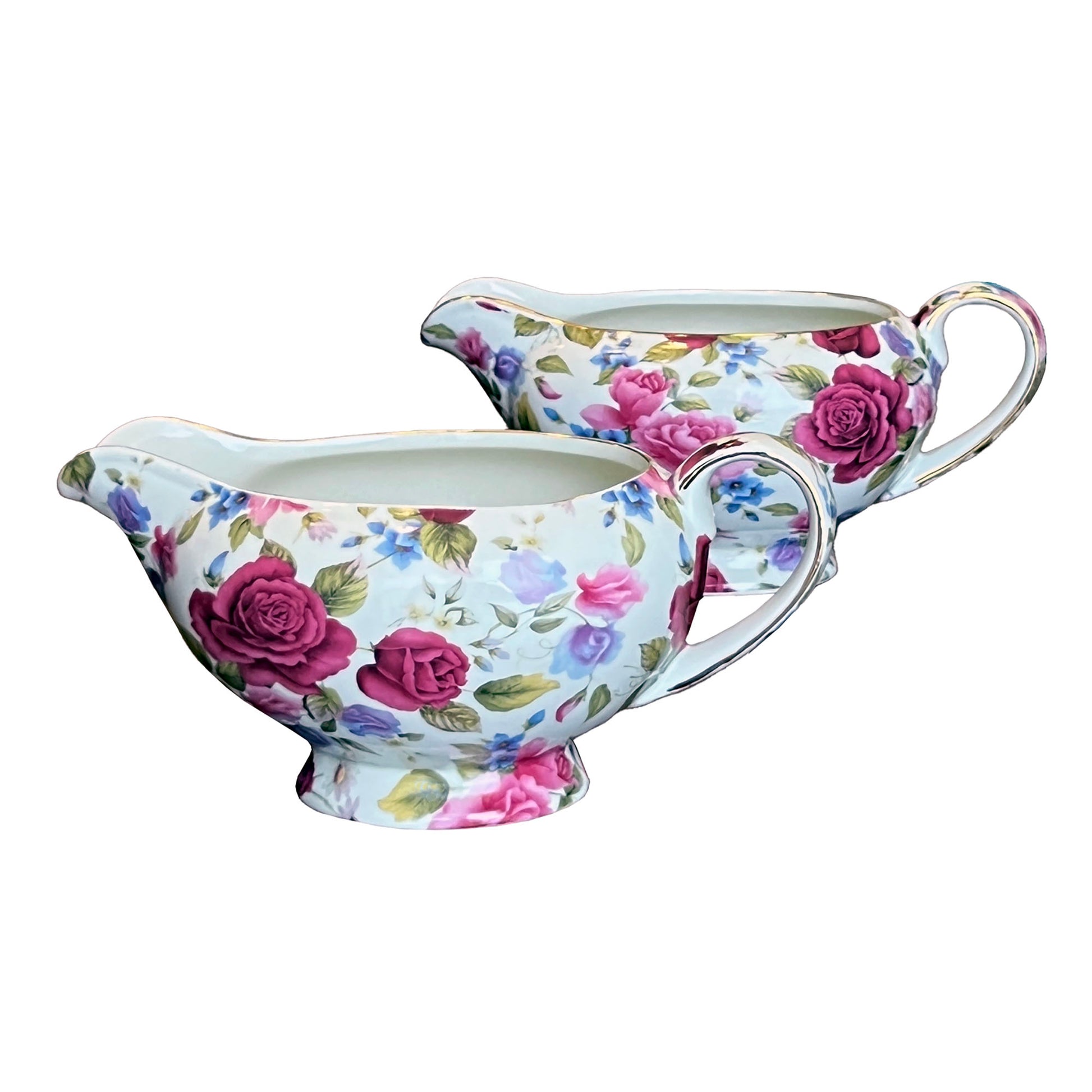 Floral-patterned gravy boat and creamer set on a white background