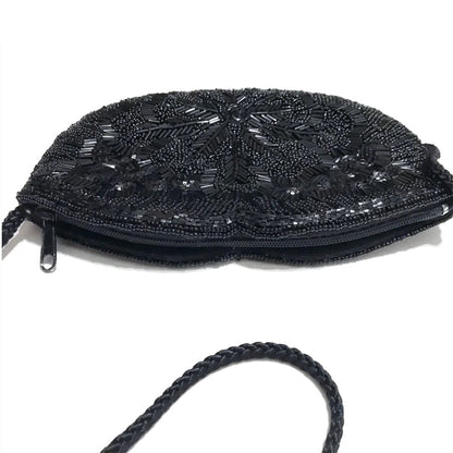 Black-Shoulder-Bag-with-Sequins-and-Beads.-Heart-Shaped.-Top-view.-showing-zipper.