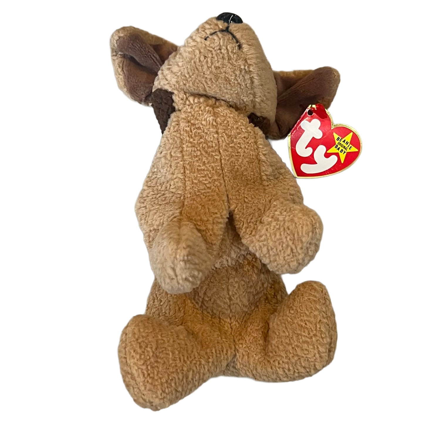 Brown puppy stuffed toy with a red and white tag on a white background