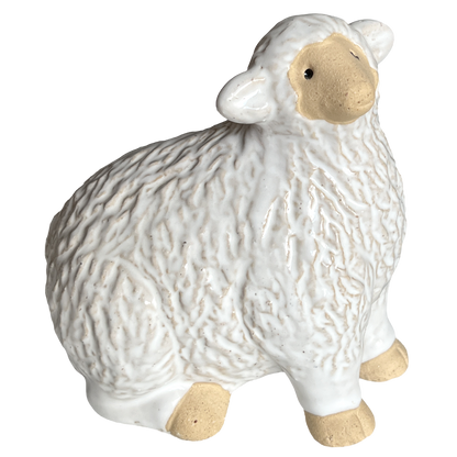 White ceramic sheep figurine on a white background.  Use for holiday decorations or farmhouse/country decor
