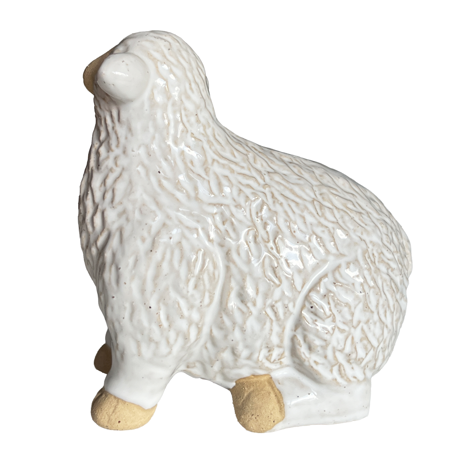 Side view of a White ceramic sheep figurine 