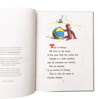 Open book with Curious George illustration and text on a white background