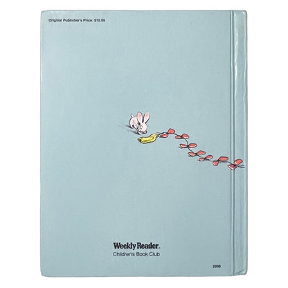 Book with a cartoon character on the back cover, featuring the Weekly Reader Children's Book Club logo.