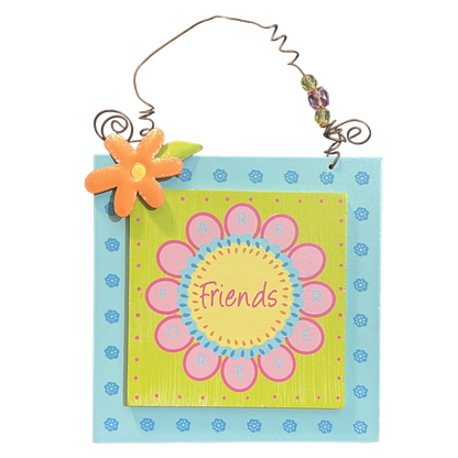 Decorative sign with a floral design and 'Friends' text on a white background