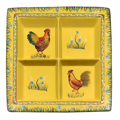 Yellow ceramic plate with rooster designs on a white background