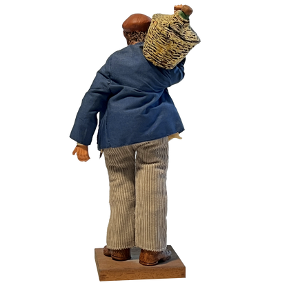 Back-side-view-of-a terracotta-grape-harvester-figurine,-France