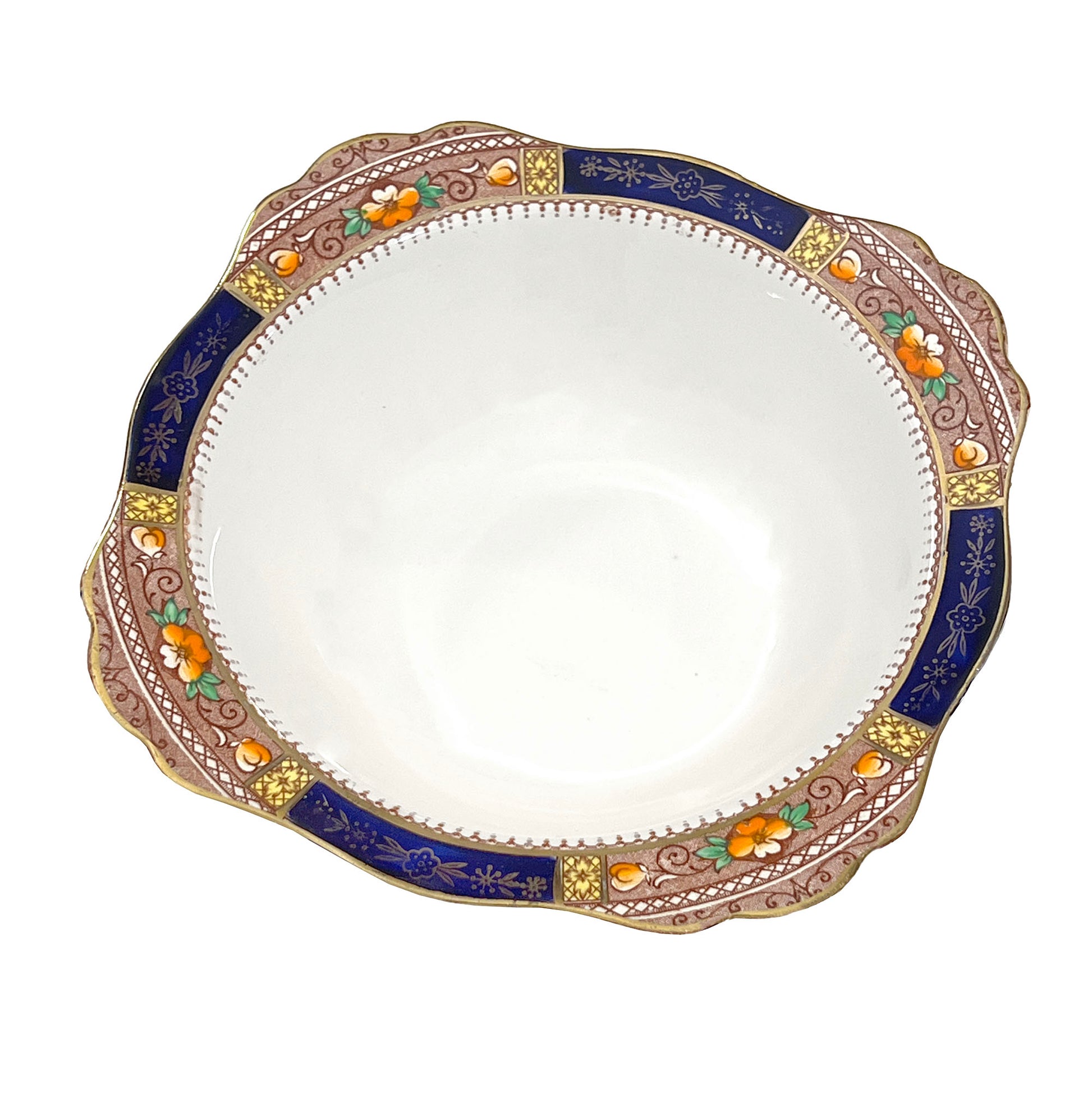 Decorative ceramic serving bowl with intricate border on a white background