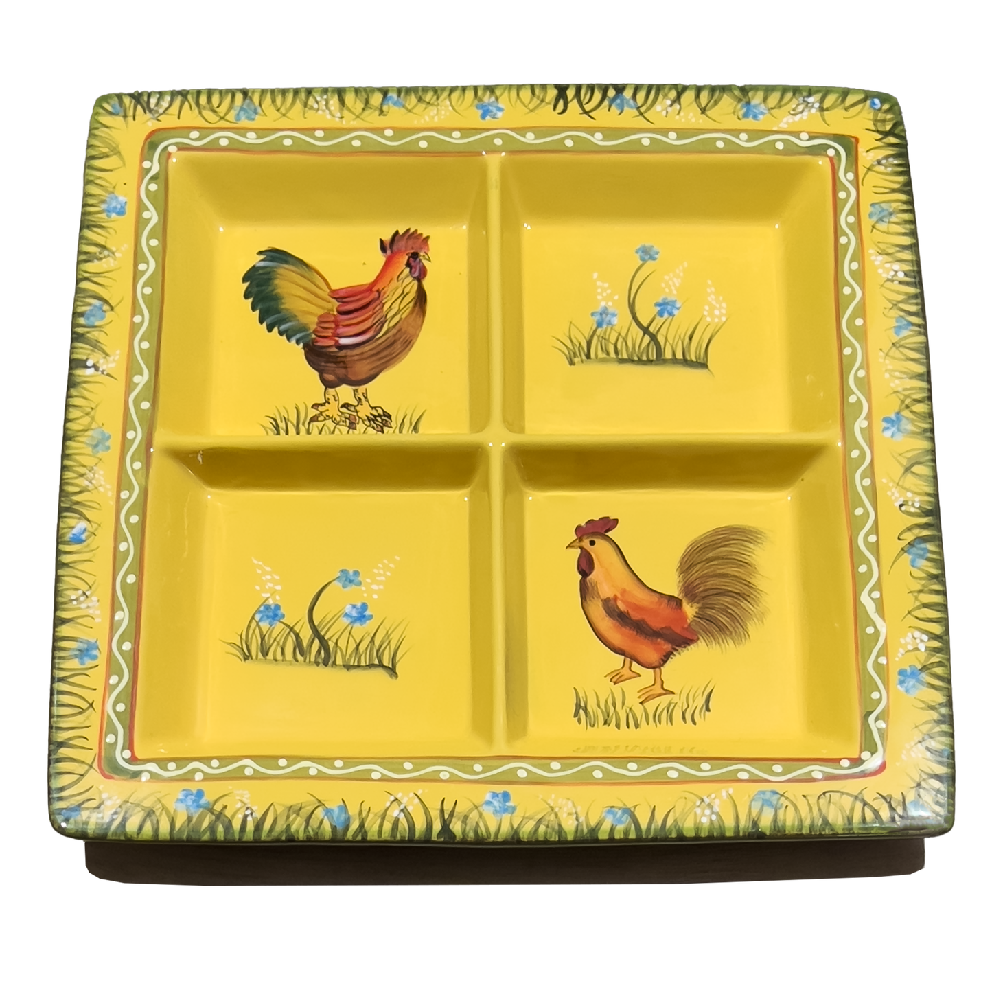 Yellow ceramic plate with rooster designs on a white background