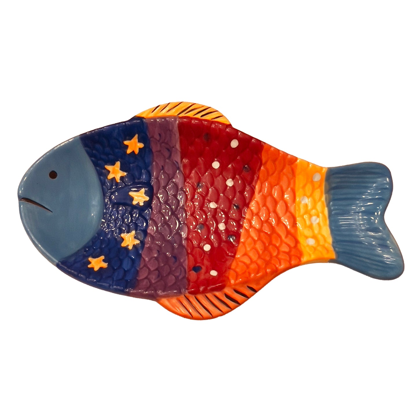 Colorful fish-shaped spoon rest with star patterns on a white background