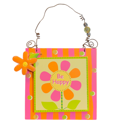 Decorative wall hanging with a colorful flower design and 'Be Happy' text on a pink and orange background