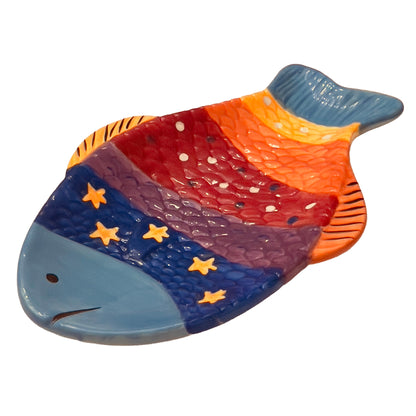 Colorful fish-shaped ceramic plate with mosaic design on a white background