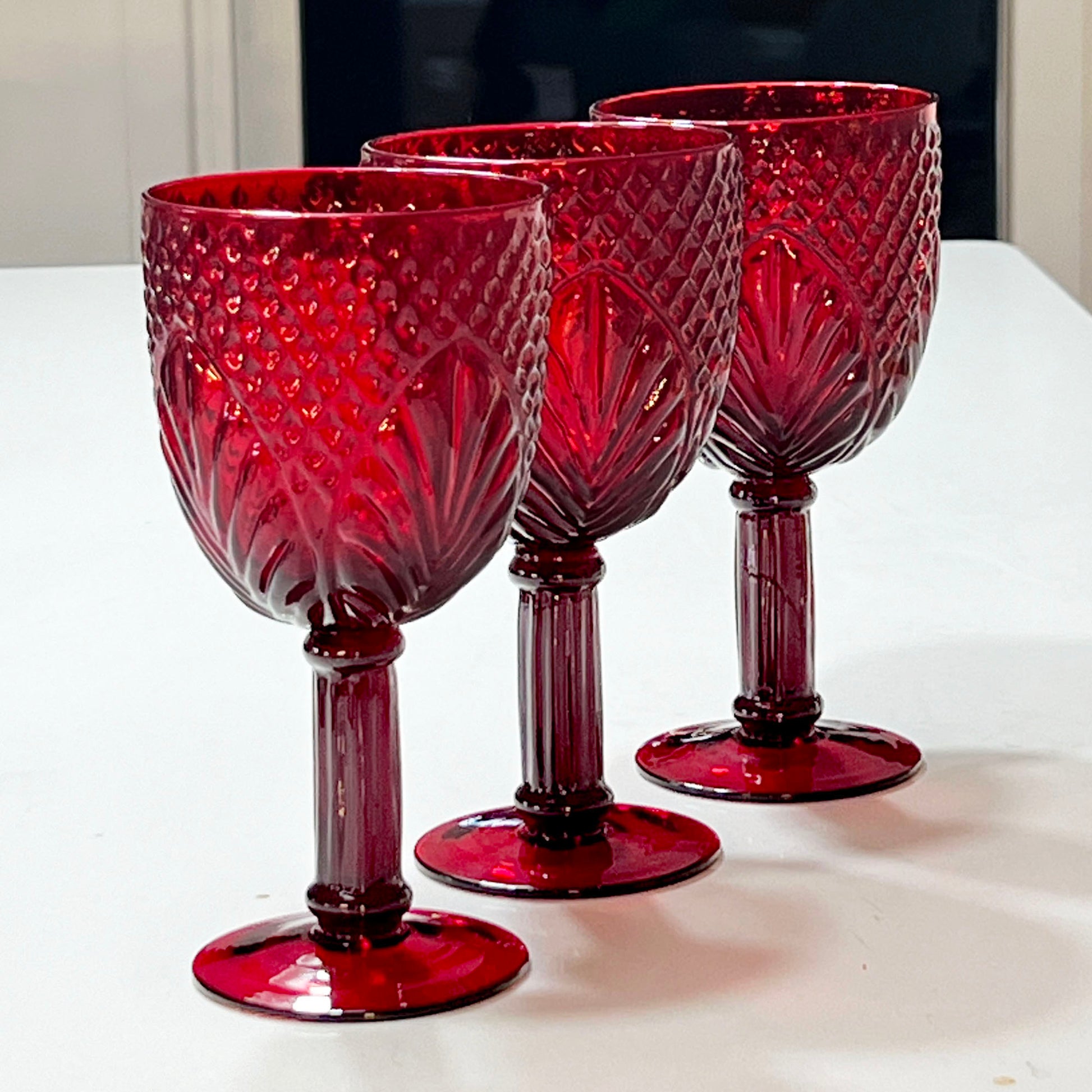 Set-of-three-red-glass-goblets.-7-in.