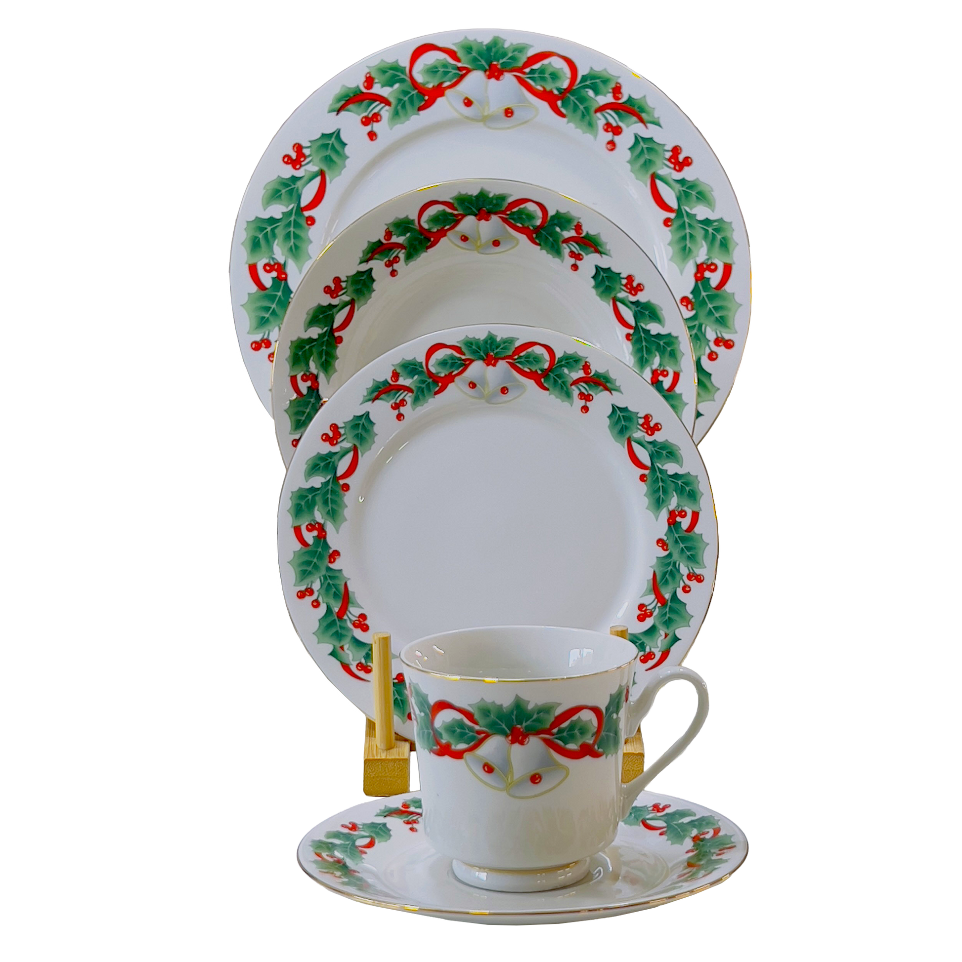 Set of Christmas-themed dinnerware with decorative patterns on a white background