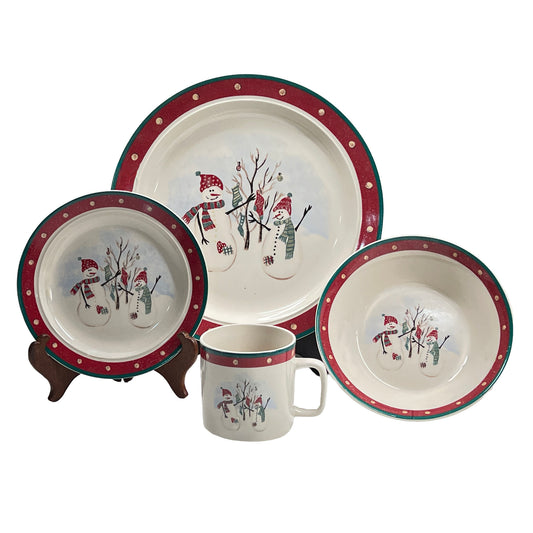 Ceramic tableware set with snowman design on a white background