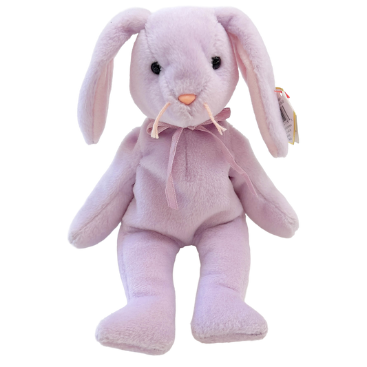 Pink plush bunny toy with a bow tie on a white background