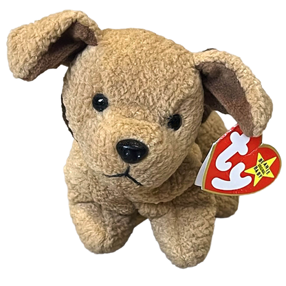 Beige plush dog toy with a red and white tag on a white background