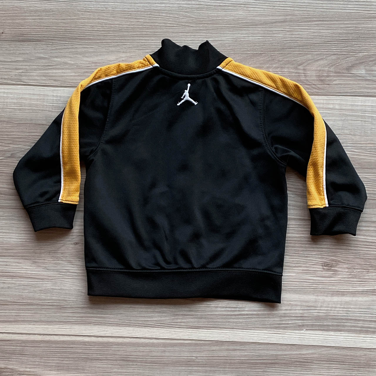 Black and shop gold jordan jacket