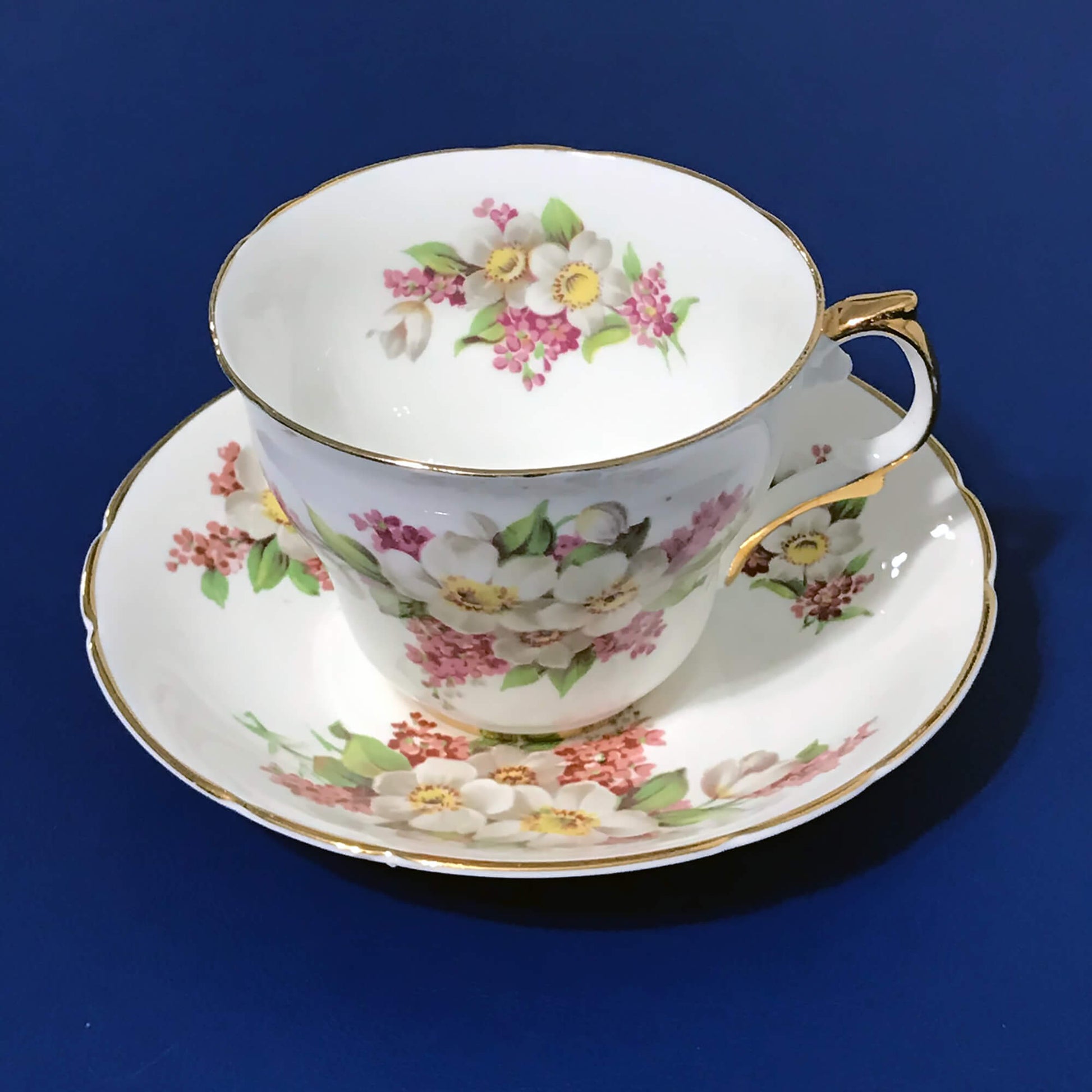 Regency-Floral-Collectible-Teacup-and-Saucer, angled view.