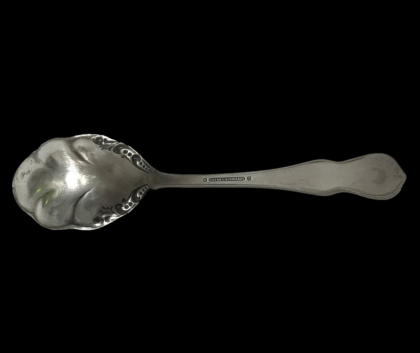 Holmes & Edwards silver sugar spoon, facing down showing logo